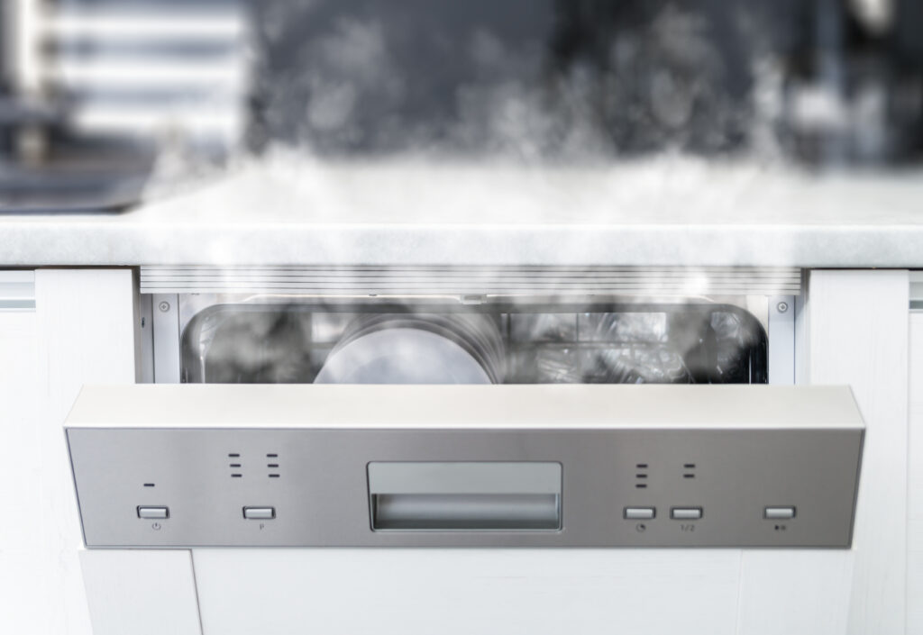 Dishwasher with spotty cloudy dishes caused by hard water mineral deposits and calcium scale
