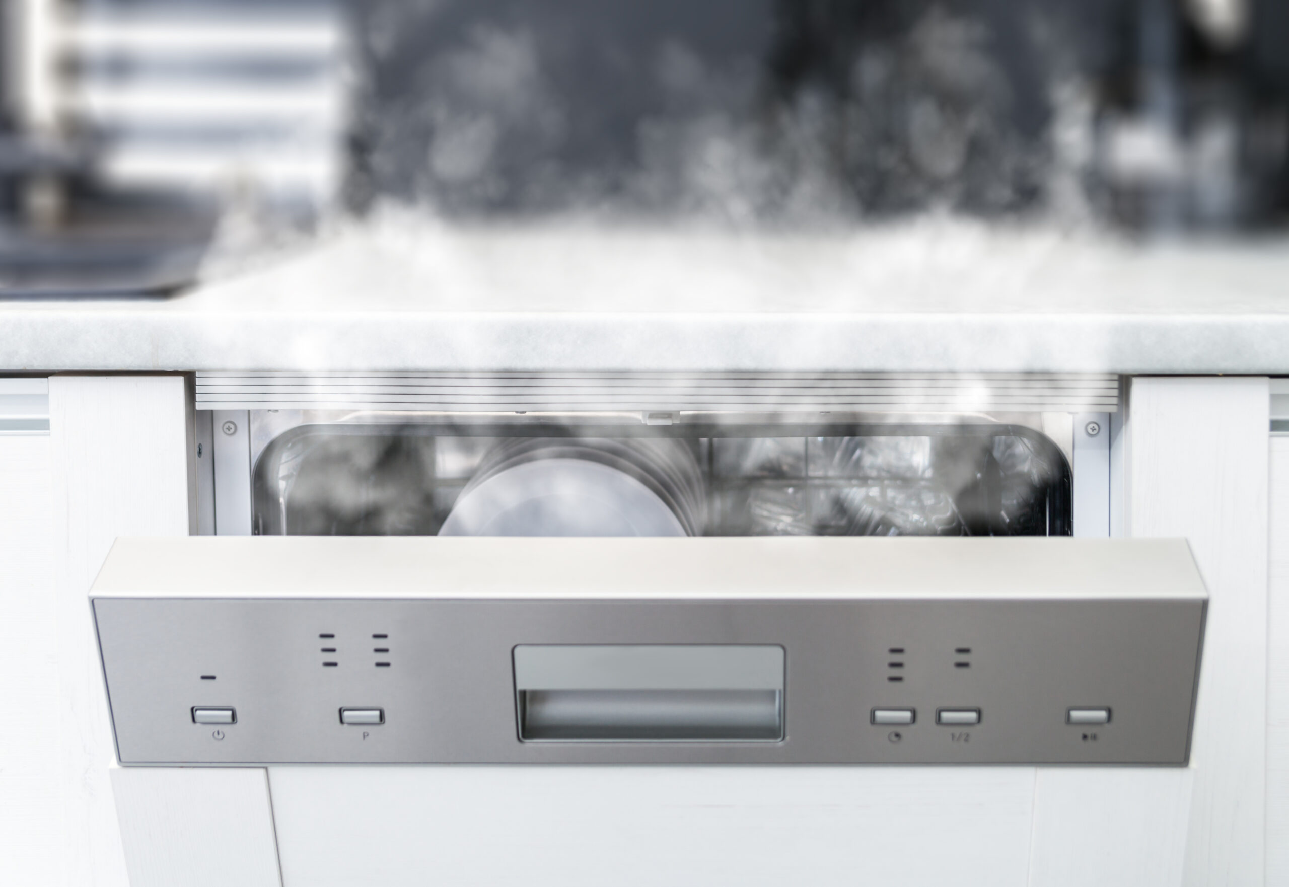 Dishwasher with spotty cloudy dishes caused by hard water mineral deposits and calcium scale